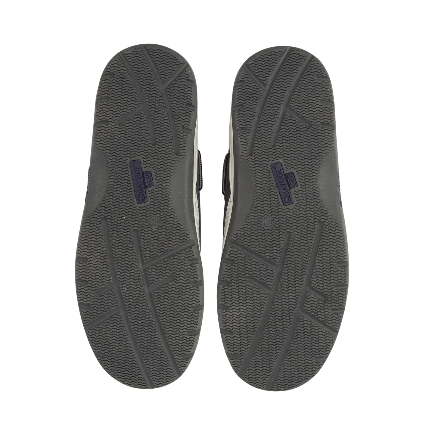 Gray shoe soles with a brand logo on a black background